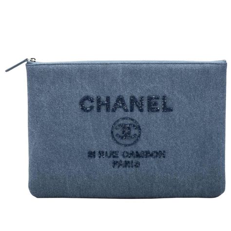 chanel clutch black gold|Chanel denim clutch.